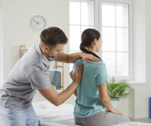 Chiropractor helping a woman